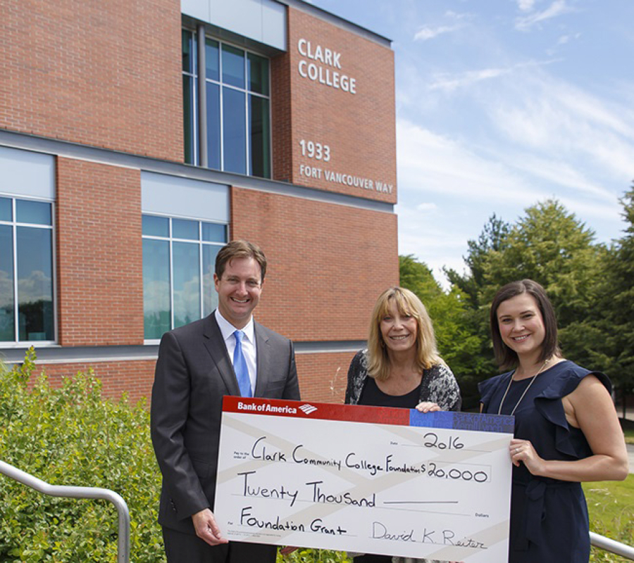Central Park: David Reiter, senior vice president and private client manager for Bank of America, left; and Jessica Hewitt, vice president of enterprise business and community engagement for Bank of America, right, present Judy Starr, director of corporate and foundation relations at the Clark College Foundation, with $20,000 grant for a student financial coach at Clark College in Vancouver.