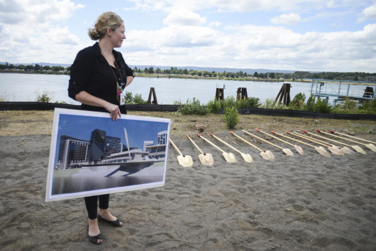 Carrie Vogelzang of Vancouver Parks and Recreation holds a poster of the Grant Street Pier, which will open as part of the Vancouver waterfront park in 2018.