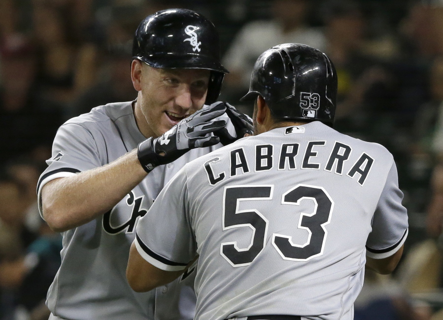 Chicago White Sox&#039; Todd Frazier, left, is greeted by Melky Cabrera (53) after Frazier hit a two-run home run to score Cabrera in the ninth inning of a baseball game, Tuesday, July 19, 2016, in Seattle. The White Sox beat the Mariners 6-1. (AP Photo/Ted S.