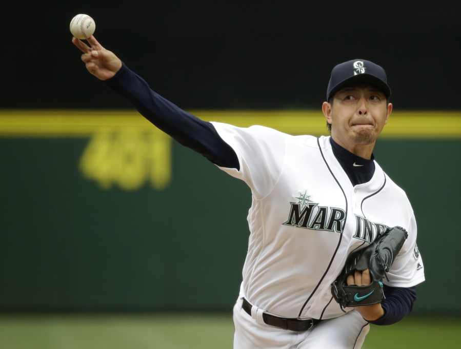 Seattle Mariners starting pitcher Hisashi Iwakuma throws against the Houston Astros in the fourth inning of a baseball game, Saturday, July 16, 2016, in Seattle. (AP Photo/Ted S.