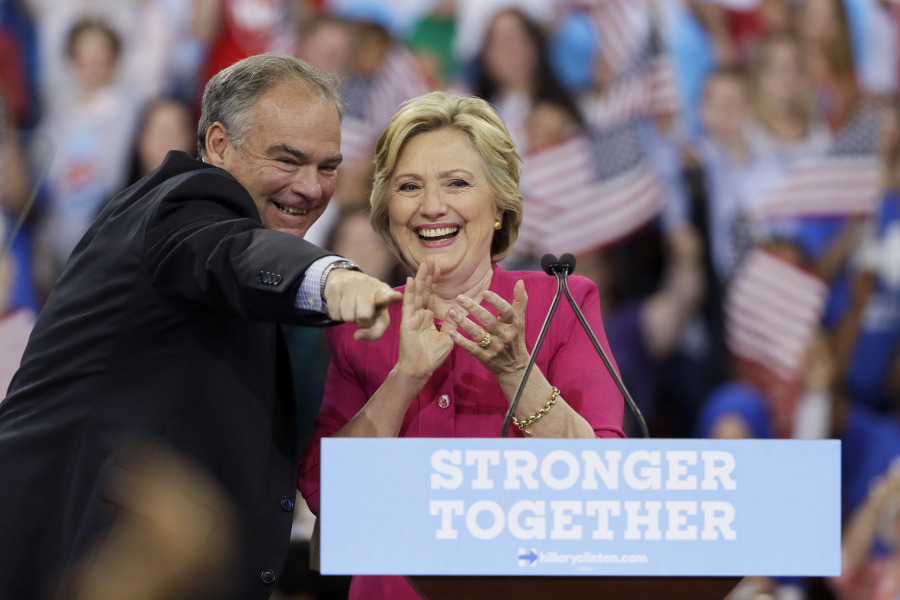 Democratic presidential candidate Hillary Clinton and her running mate, Sen. Tim Kaine, D-Va., react Friday after a campaign rally at Temple University in Philadelphia.