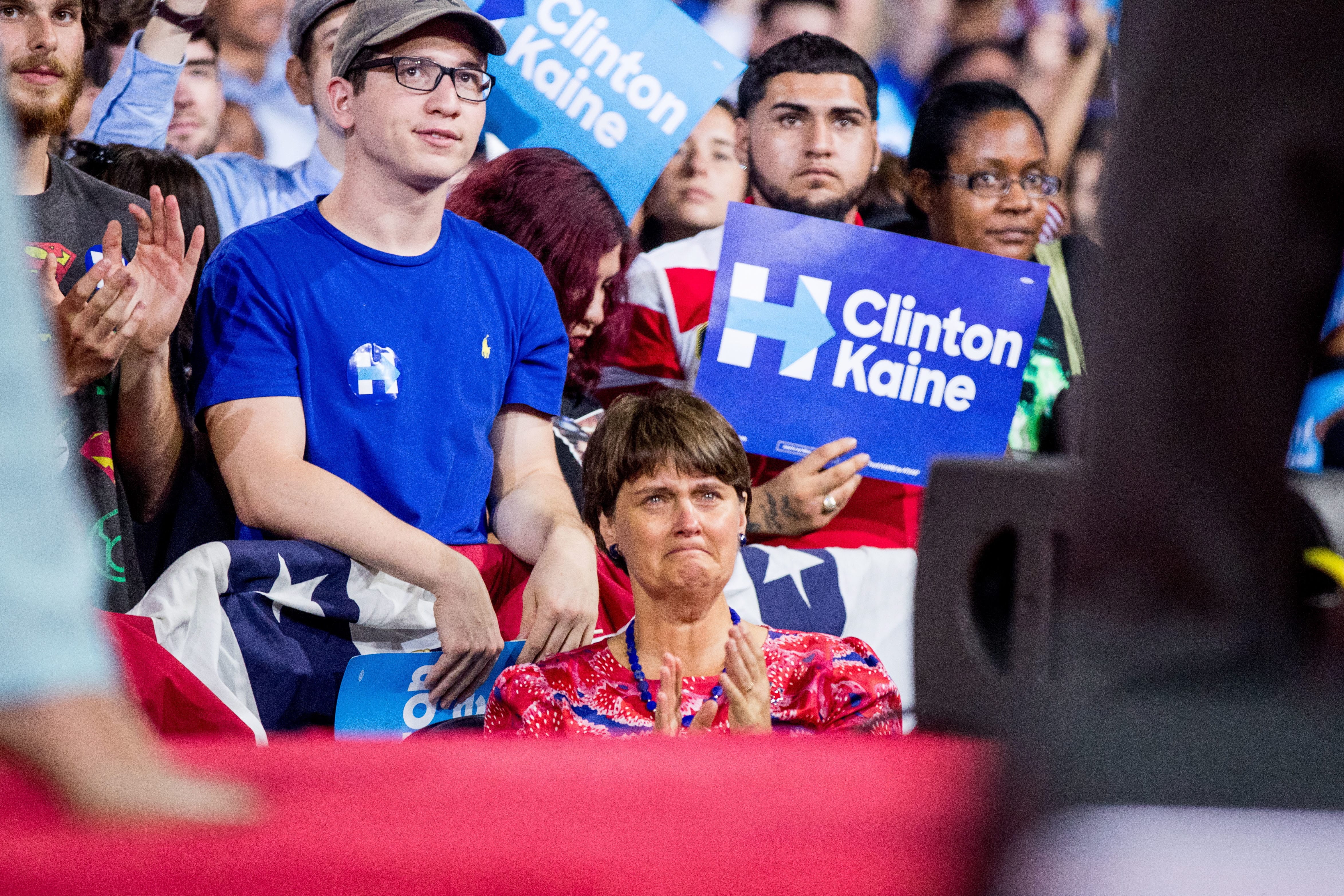 Anne Holton, center, the wife of Sen. Tim Kaine, D-Va., becomes emotional as Kaine tells the audience that their son will be deployed to Europe as a Marine as he speaks at a rally with Democratic presidential candidate Hillary Clinton at Florida International University Panther Arena in Miami, Saturday, July 23, 2016. Clinton has chosen Kaine to be her running mate.
