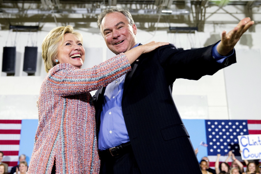 In this July 14, 2016, file photo, Democratic presidential candidate Hillary Clinton, accompanied by Sen. Tim Kaine, D-Va., speaks at a rally at Northern Virginia Community College in Annandale, Va.