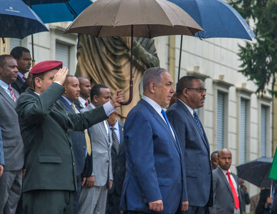 Israeli Prime Minister Benjamin Netanyahu, second right, and Ethiopian Prime Minister Hailemariam Dessalegn, right, watch the guard of honour in Ethiopian National Palace in Addis Ababa, Ethiopia, on Thursday. Netanyahu is on one day state visit to Ethiopia.