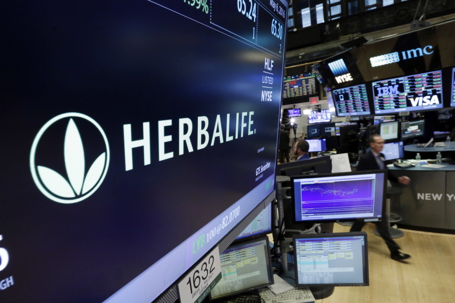 The Herbalife logo appears above the post where it trades on the floor of the New York Stock Exchange.