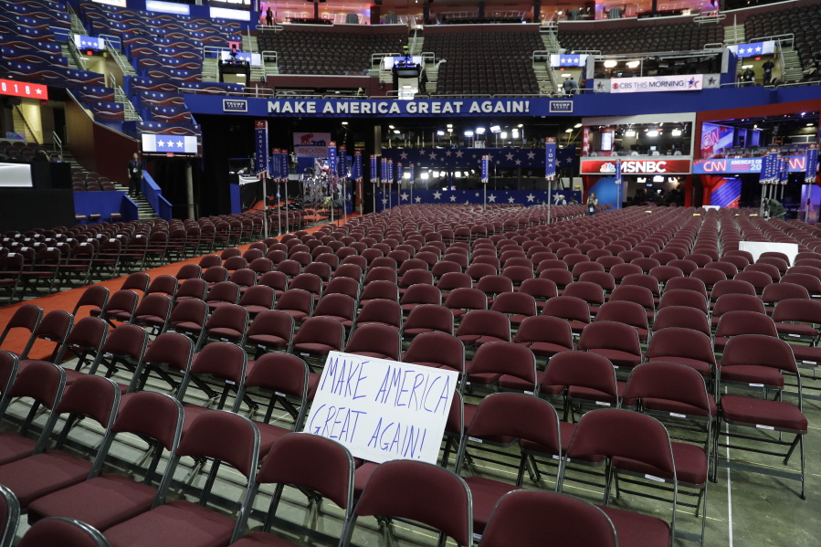 A sign sits on empty chairs before the third day session of the GOP 2016 Convention, Wednesday in Cleveland.