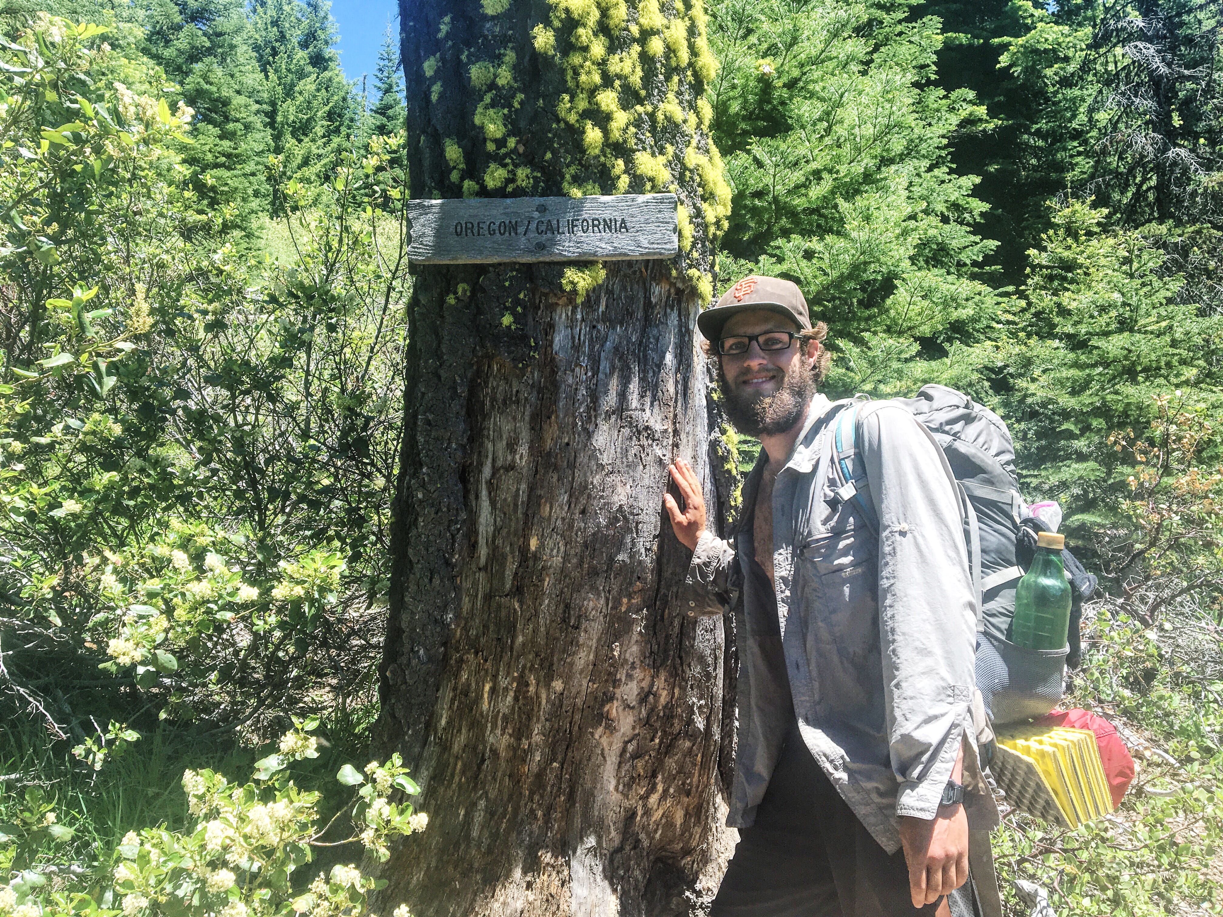 Jeff Garmire of Vancouver poses at the California-Oregon border on his northbound journey up the Pacific Crest Trail.