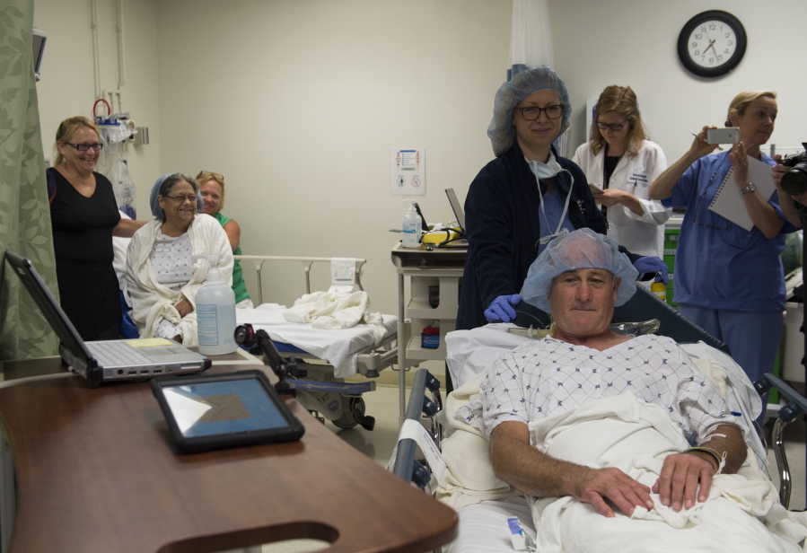 Brenda Hudson watches as her husband and kidney donor, Dana Hudson, is taken to the operating room to undergo a living donor kidney transplant on June 28 at MedStar Georgetown University Hospital in Washington. Hudson received a donated kidney from her sister Michelle 40 years ago, after lupus destroyed her own kidneys&#039; function.