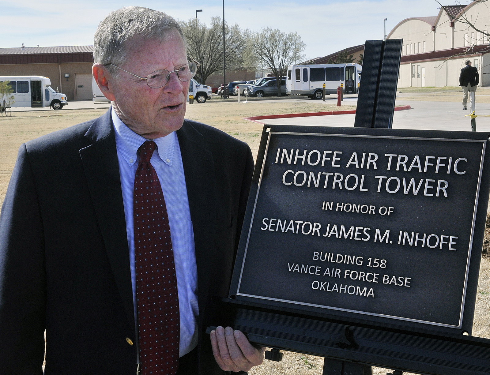 U.S. Senator James Inhofe stands next to a plaque bearing his name after a dedication ceremony in March for the new air traffic control town at Vance Air Force Base in Enid, Okla. Severe weather forced Inhofe to land an airplane at a small airport in Oklahoma, his spokeswoman said Sunday night. Donelle Harder, a spokeswoman for the Oklahoma Republican, said Inhofe was out flying Sunday evening when the weather forced him to land in Ketchum, about 70 miles northeast of Tulsa.