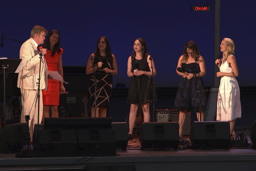 In this image made from video, writer and humorist Garrison Keillor, left, hosts his final broadcast of the weekly radio variety show &quot;A Prairie Home Companion&quot; Friday, July 1, 2016, at the Hollywood Bowl in Los Angeles, Calif. His guests included musicians, from left to right: Heather Masse, Christine DiGiallonardo, Sarah Jarosz, Sara Watkins and Aoife O&#039;Donovan.