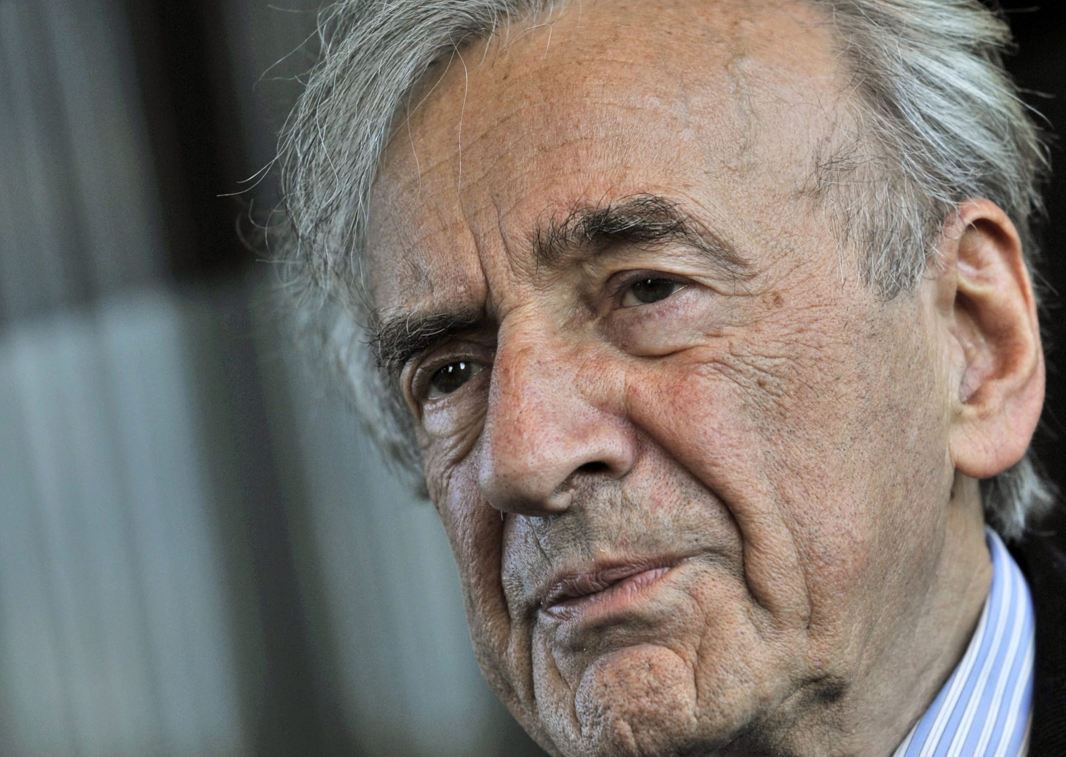 FILE - In this Dec. 10, 2009 file photo, Elie Wiesel listens during an interview with The Associated Press in Budapest, Hungary.  Wiesel, the Nobel laureate and Holocaust survivor has died.  His death was announced Saturday, July 2, 2016  by Israel's Yad Vashem Holocaust Memorial.
