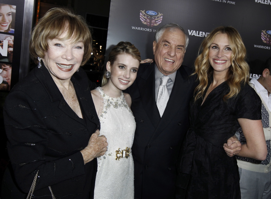 FILE - In this Feb. 8, 2010 file photo, Shirley MacLaine, from left, Emma Roberts, Garry Marshall, and Julia Roberts arrive at the premiere for &quot;Valentine&#039;s Day&quot; on Feb. 8, 2010, in Los Angeles. Writer-director Marshall, whose TV hits included &quot;Happy Days,&quot; &quot;Laverne &amp; Shirley&quot; and box-office successes including &quot;Pretty Woman&quot; and &quot;Runaway Bride,&quot; has died at age 81. Publicist Michelle Bega says Marshall died Tuesday in at a hospital in Burbank, Calif., of complications from pneumonia after having a stroke.