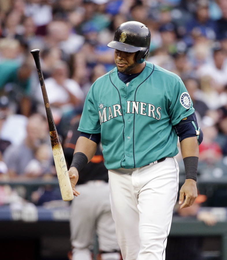 Seattle Mariners&#039; Nelson Cruz heads back to the dugout after striking out swinging against the Baltimore Orioles in the third inning of a baseball game Friday, July 1, 2016, in Seattle.