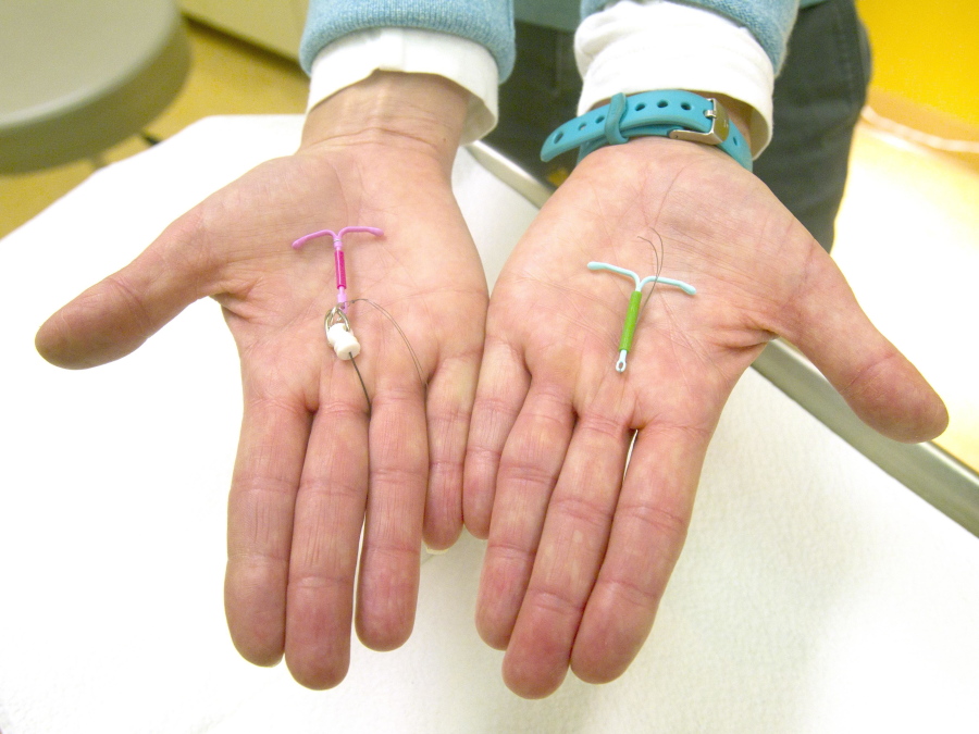 Dr. Susan Gorman displays the Skyla IUD, left, and the Mirena IUD in 2015 at High Lakes Woman&#039;s Center in Redmond, Ore.