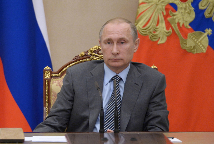 Russian President Vladimir Putin chairs a meeting of Russia&#039;s cabinet in the Kremlin in Moscow, Russia, Friday.