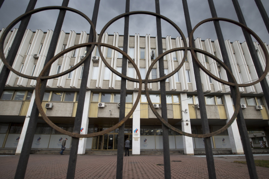 People walk in front of the Russian Olympic Committee building in Moscow.