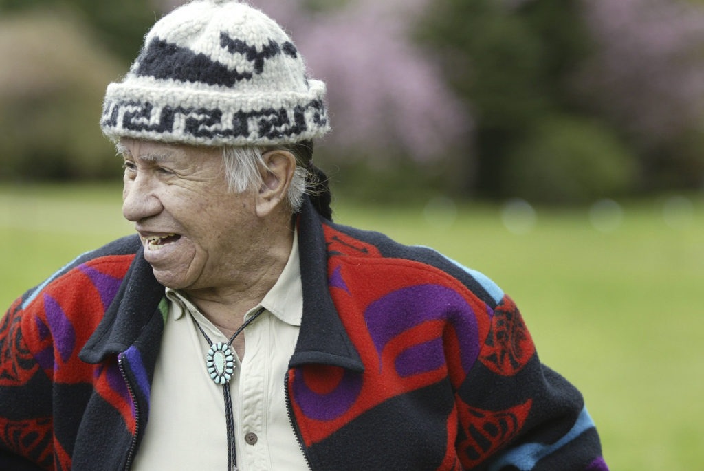 Billy Frank smiles as he walks along the Nisqually River near Olympia on April 14, 2005, where he was born and lived as a child. The Nisqually Indian elder and activist contributed leadership and multiple arrests to the battle fought by Northwest Indian tribes for their treaty-negotiated salmon-fishing rights.