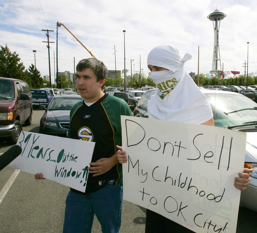 With Seattle's famous Space Needle in the background, Seattle SuperSonics fans Aaron Morse, and Ben Conway, both 18, protest the sale of the NBA basketball team in Seattle on July 18, 2006. July 18, 2016 will mark 10 years since the Seattle SuperSonics — the city's first professional sports franchise — was sold by Starbucks CEO Howard Schultz and the Basketball Club of Seattle to Clayton Bennett and the Professional Basketball Club LLC based in Oklahoma City. (Ted S.