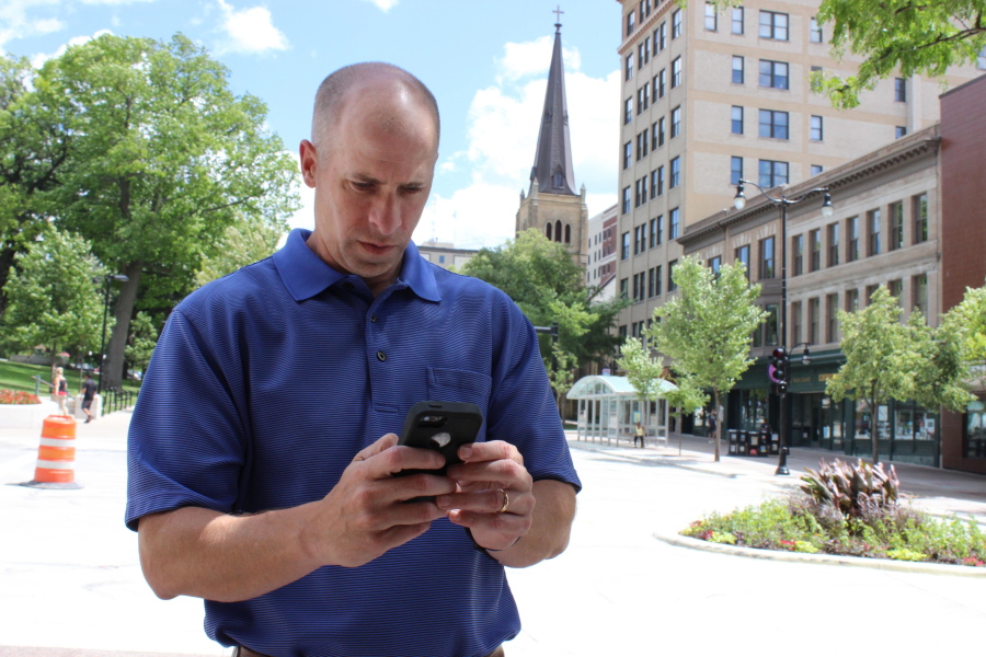 Associated Press reporter Todd Richmond tries to conquer &quot;Pokemon Go&quot; while walking around downtown Madison, Wis., on July 14. The 44-year-old downloaded the app and played the game in an attempt to understand its popularity.