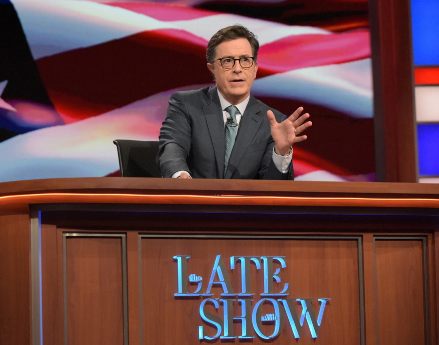 Stephen Colbert, host of &quot;The Late Show with Stephen Colbert,&quot; appears during a broadcast in New York. Lawyers representing his old show company complained to CBS after Colbert revived the character he played under his own name on &quot;The Colbert Report,&quot;  a clueless, full-of-himself cable news host.