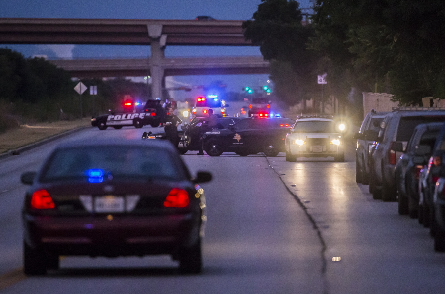 Law enforcement officers from multiple Central Texas agencies respond to reports of an officer down in Round Rock, Texas, on Monday. A Texas sheriff&#039;s deputy was shot and killed at his home north of Austin before dawn on Monday in what authorities said appeared to be an attempted burglary. (Ricardo B.
