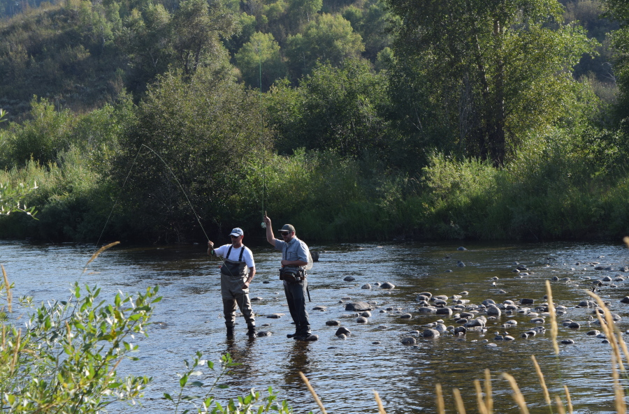 Men are seen fly fishing Aug. 19, 2015, on the Yampa River near downtown Steamboat Springs, Colo. Steamboat Springs is known as a skier&#039;s haven with &quot;Champagne powder&quot; snow, but there&#039;s plenty to do here in summer, too.