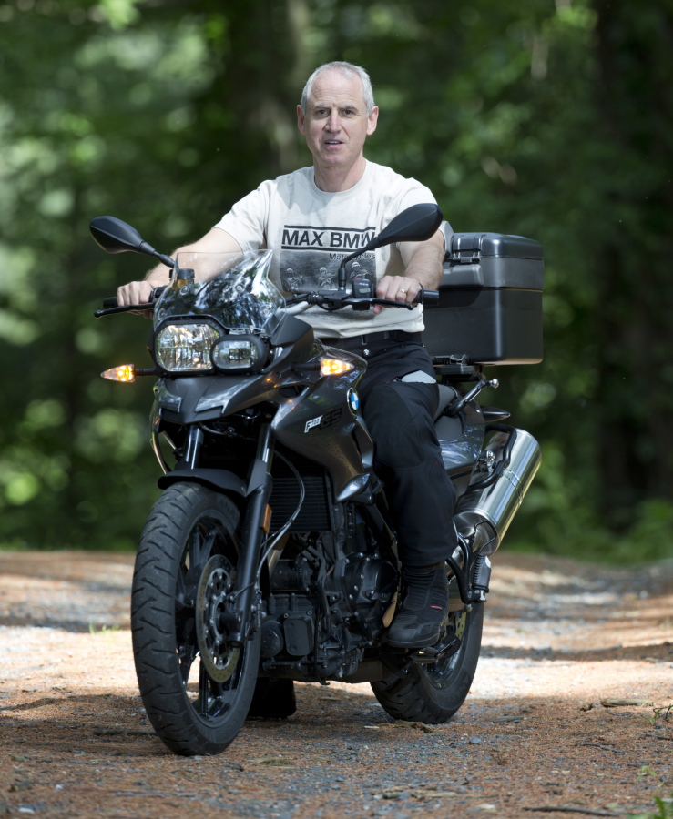Dan Ruderman poses in June on a motorcycle at his home in Great Barrington, Mass. Ruderman plans to join a cross-country motorcycle trip to celebrate the 1916 trip made by his grandmother Adeline Van Buren and her sister Augusta Van Buren.
