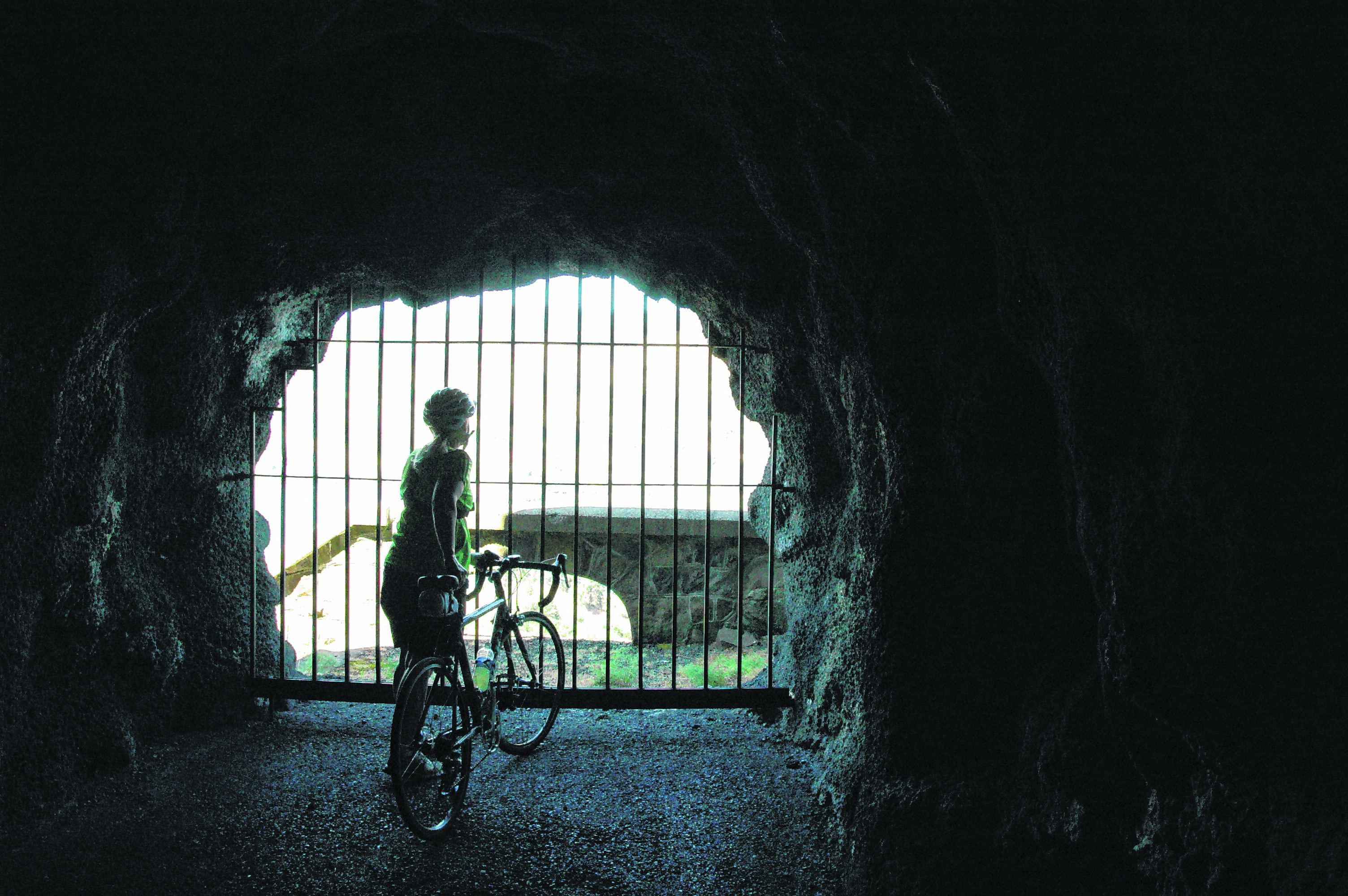 The openings in the Mosier Twin Tunnels, called adits, provide a refreshing breeze for cyclists and hikers using the Historic Columbia River Highway State Trail between Hood River and Mosier in Oregon.