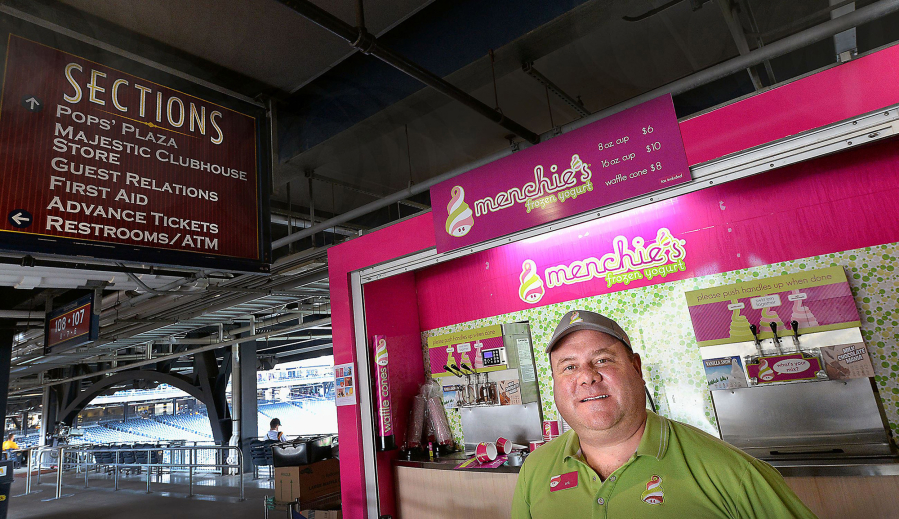 Erik Lingren, owner of Menchie&#039;s Frozen Yogurt at PNC Park, stands in front of his kiosk at Section 107 in Pittsburgh.