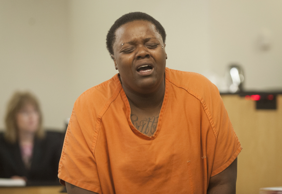Veronica Britt reacts to hearing that a class A felony charge carries the possibility of a life sentence as she appears in court in Vancouver on  Oct. 12. On Thursday, she pleaded guilty to first-degree promoting prostitution and communicating with a minor for immoral purposes and was sentenced to nearly two years in prison.