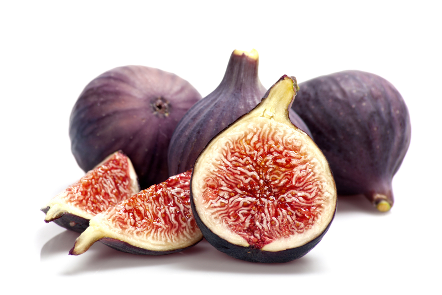 Sliced ripe figs on white background