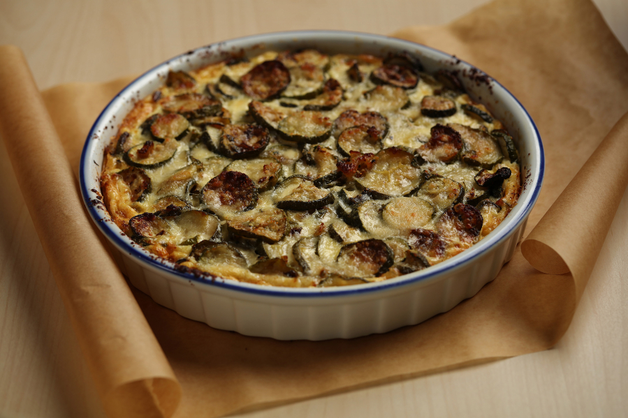 Garden-fresh zucchini is roasted to remove some of the moisture before being mixed into the filling for a savory summer tart. (E.