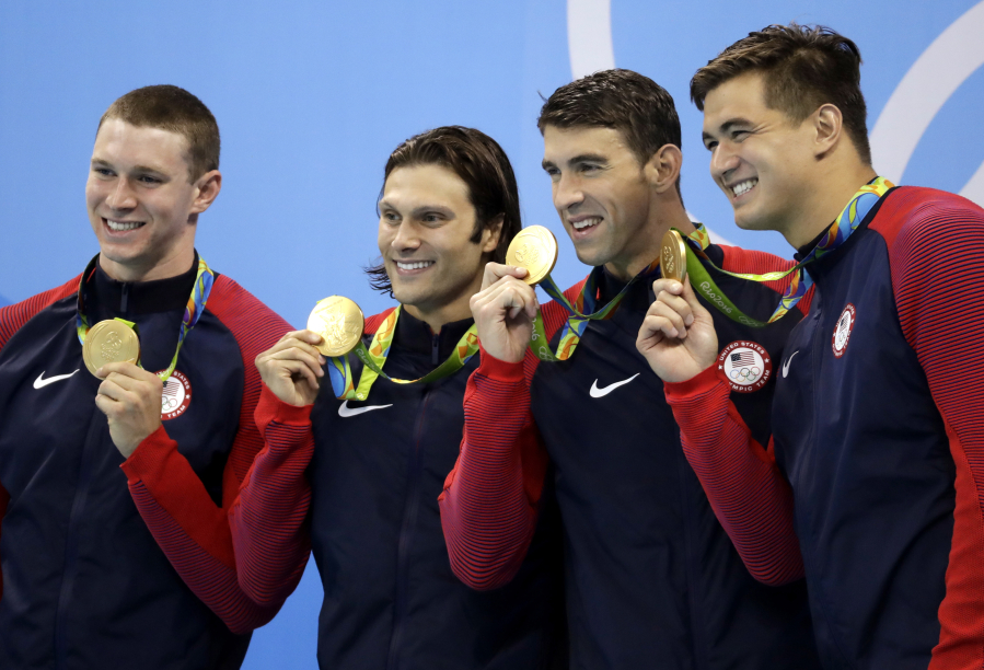 Bremerton&#039;s Nathan Adrian, right, stands with 4x100-meter medley relay teammates, from left, Ryan Murphy, Cody Miller and Michael Phelps. The team won gold in Rio.