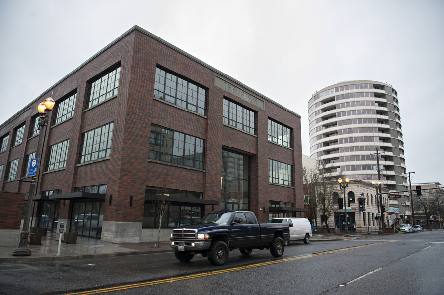 A motorist passes the new Hudson building in January in downtown Vancouver.