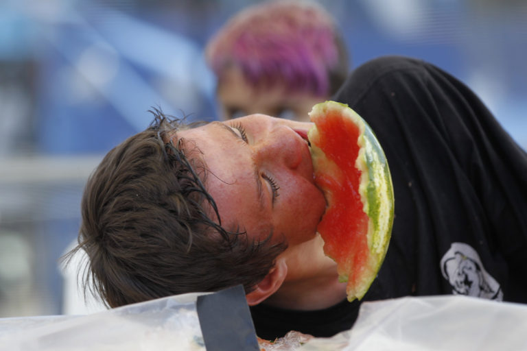 Joseph Scott-Elder, 15, of Astoria, competes in the watermelon eating contest at the Clark County Fair. Scott-Elder took first place.