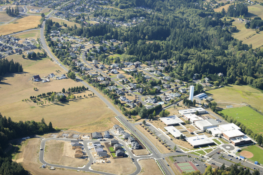 An aerial photo shows residential development along Hillhurst Road near Ridgefield High School.