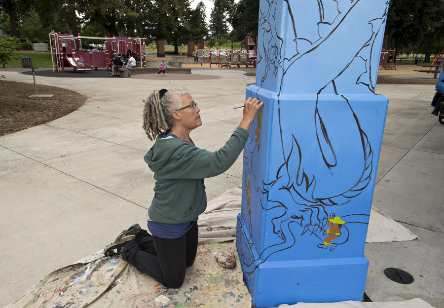 Vancouver artist Jane Degenhardt brings imagination to life while working on a mural Tuesday at Marshall Community Park Picnic Shelter. The project, which was commissioned by the Clark County Mural Society, features characters of fairy tales and folktales within the context of a Northwest landscape.