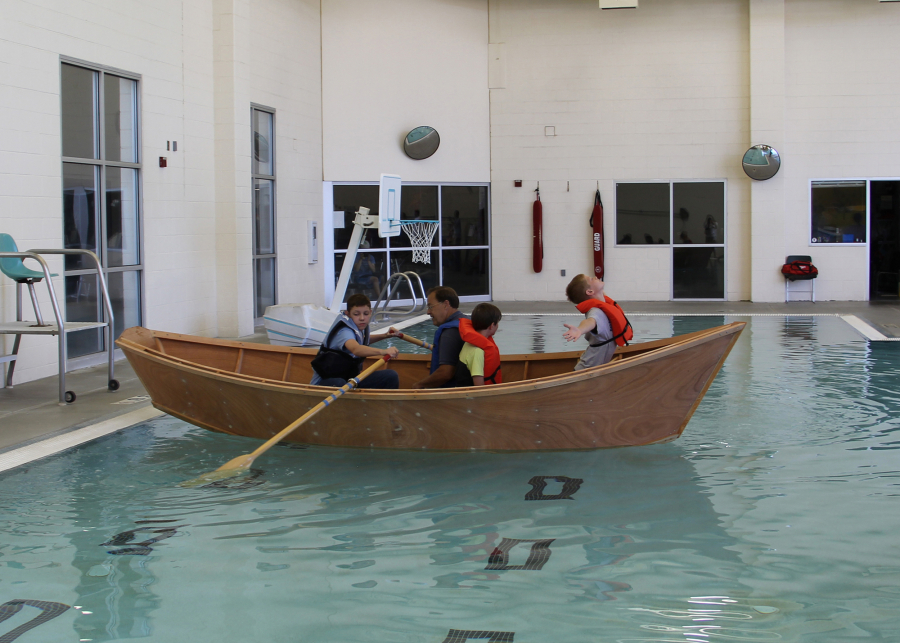 Bagley Downs: Lucas Rogers, from left, Peter Cray, Braydon Schaberg and Conner Copeland riding a boat they built during a three-week Vancouver Public Schools summer program hosted by the Wind &amp; Oar Boat School.