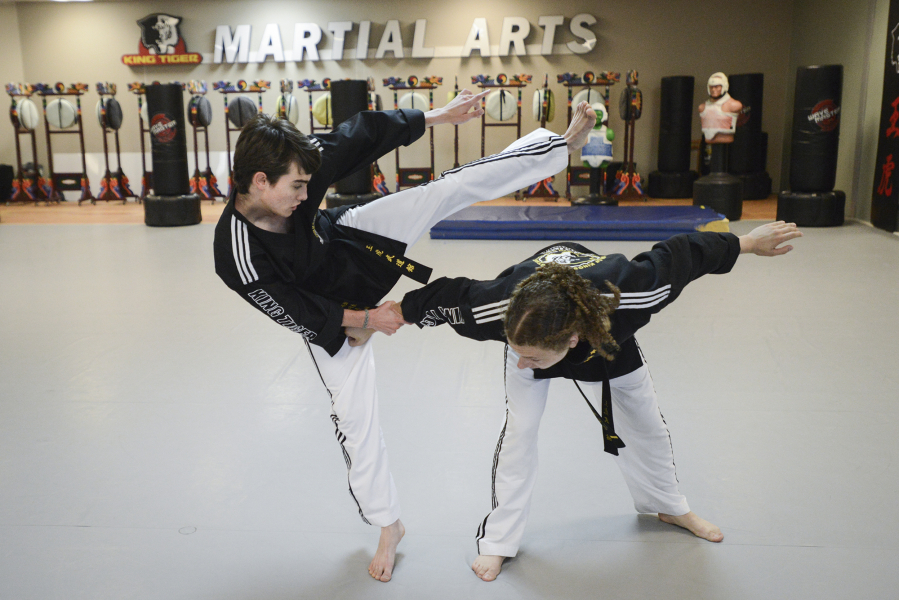 Seventeen-year-old Aiden Bartocci, left, and sixteen-year-old Enzo LaFont practice at King Tiger Martial Arts in Vancouver, Tuesday August 23, 2016. The Vancouver teens are going to South Korea in September to represent the USA at the first World Martial Arts Mastership.