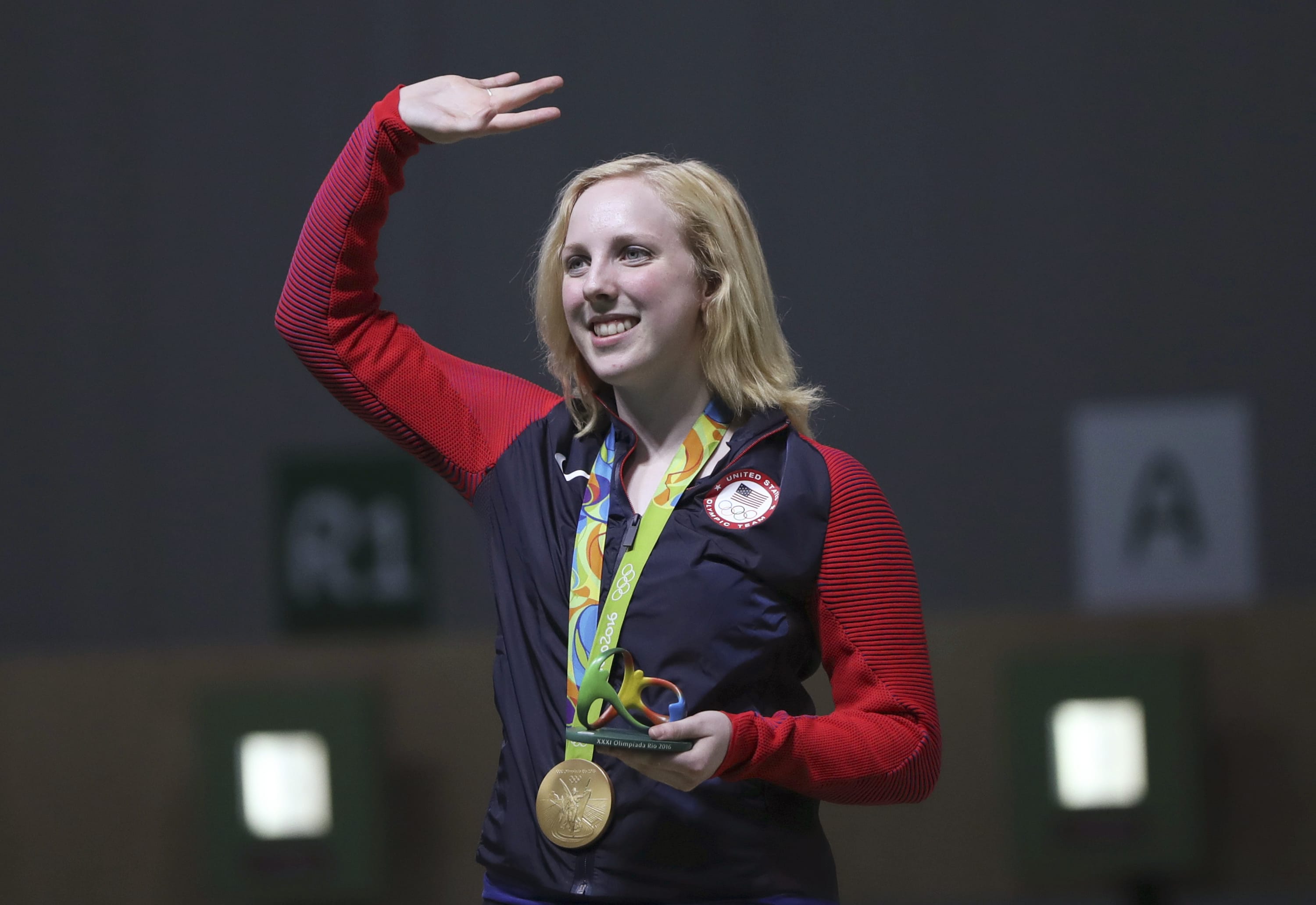 Virginia Thrasher of the United States waves after she received the gold medal for the Women's 10m Air Rifle competition at Olympic Shooting Center at the 2016 Summer Olympics in Rio de Janeiro, Brazil, Saturday, Aug. 6, 2016.