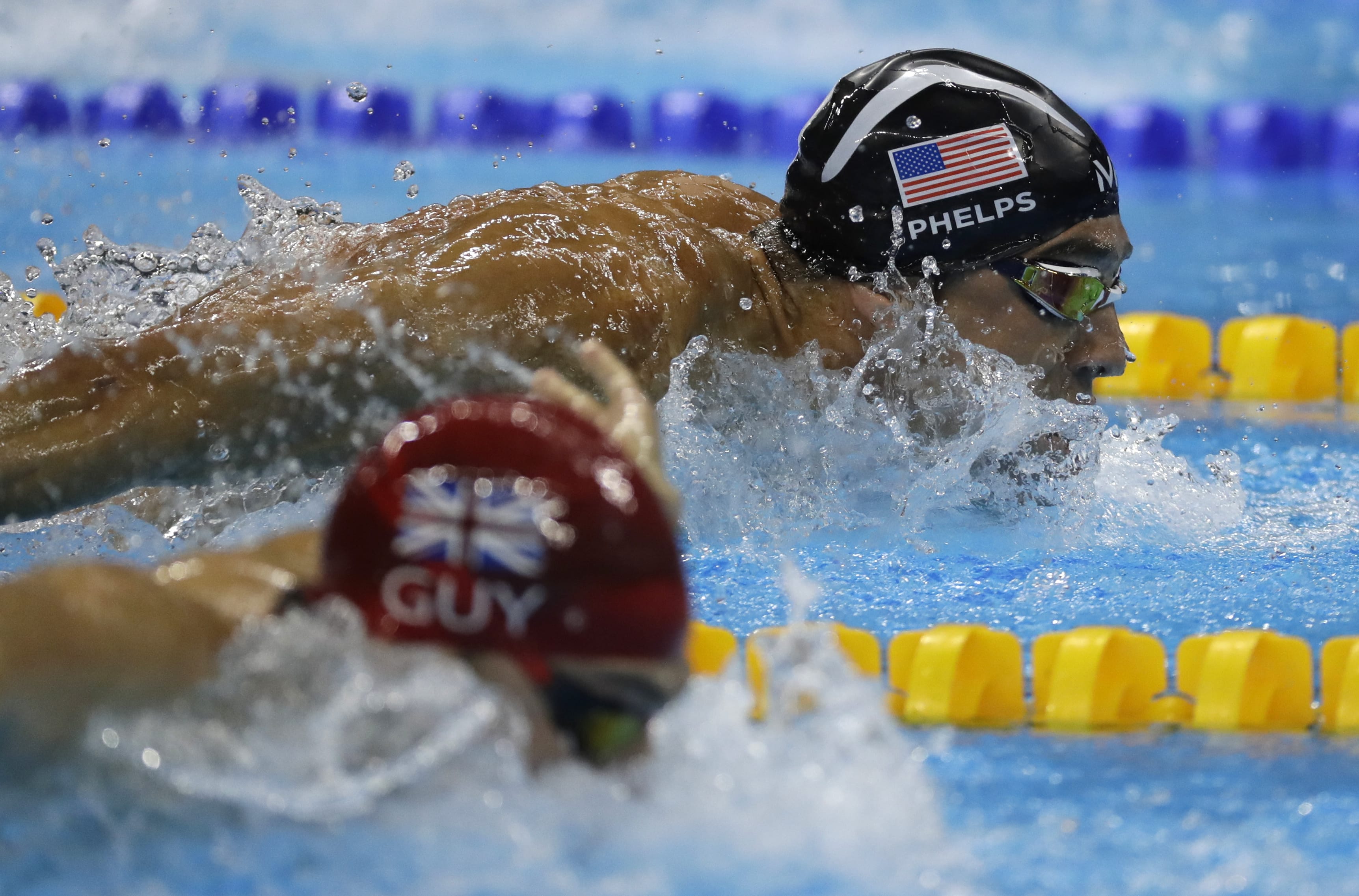 United States' Michael Phelps and Britain's James Guy compete in the men's 4 x 100-meter medley relay final during the swimming competitions at the 2016 Summer Olympics, Saturday, Aug. 13, 2016, in Rio de Janeiro, Brazil.