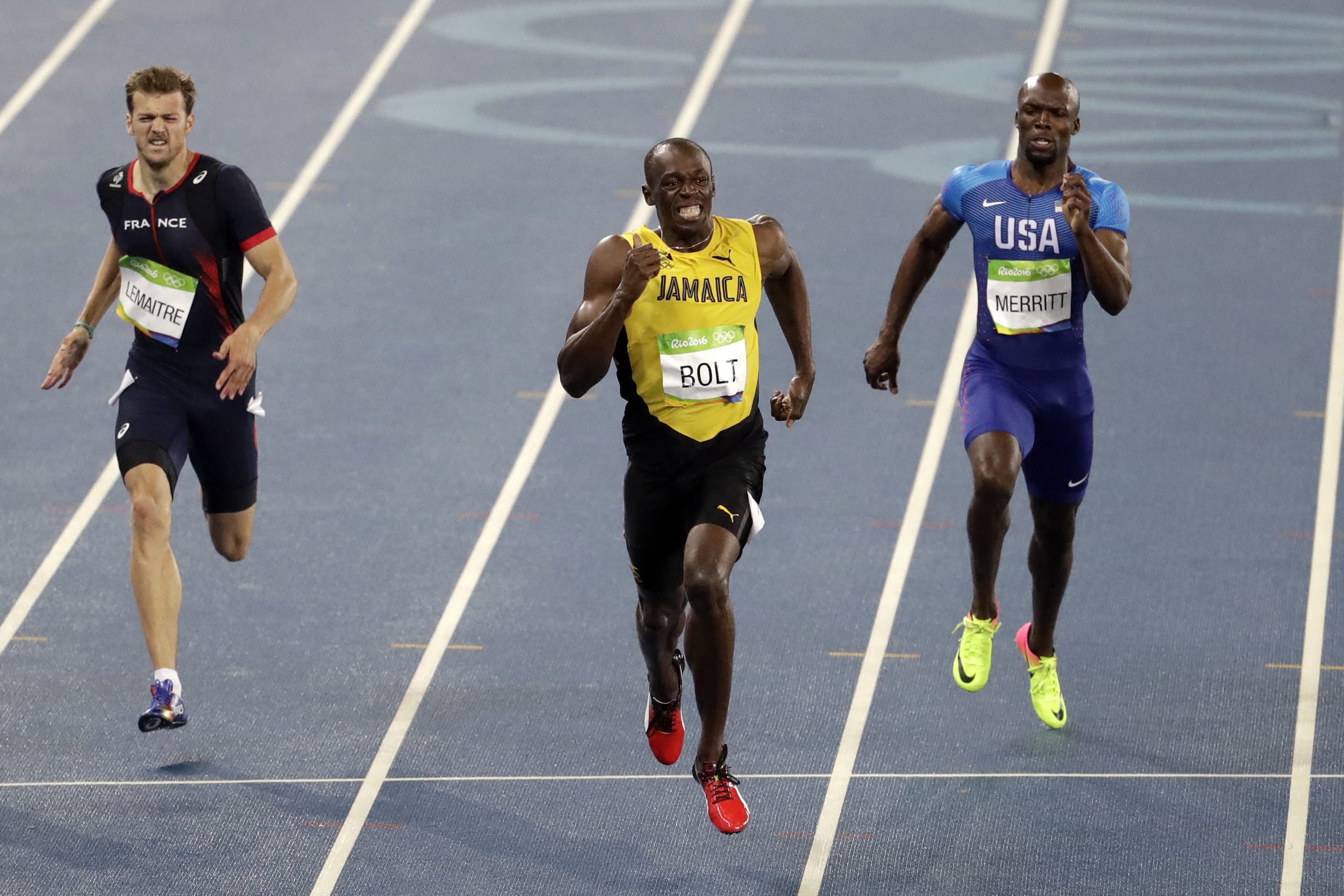 Usain Bolt from Jamaica, center, wins the gold medal in the men's 200-meter final during the athletics competitions of the 2016 Summer Olympics at the Olympic stadium in Rio de Janeiro, Brazil, Thursday, Aug. 18, 2016.