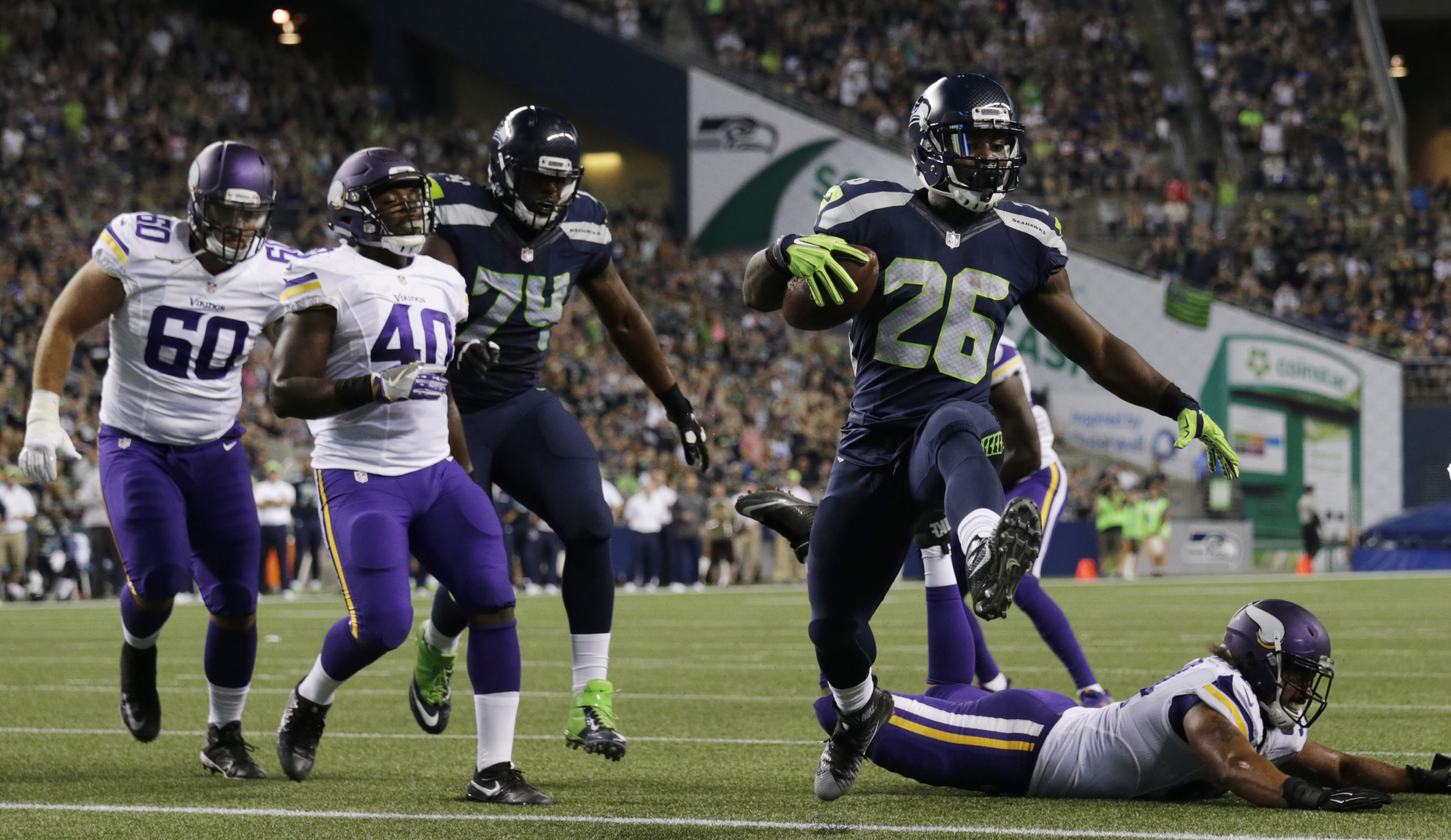 Seattle Seahawks running back Troymaine Pope (26) scores a touchdown against the Minnesota Vikings during the second half of a preseason NFL football game Thursday, Aug. 18, 2016, in Seattle.