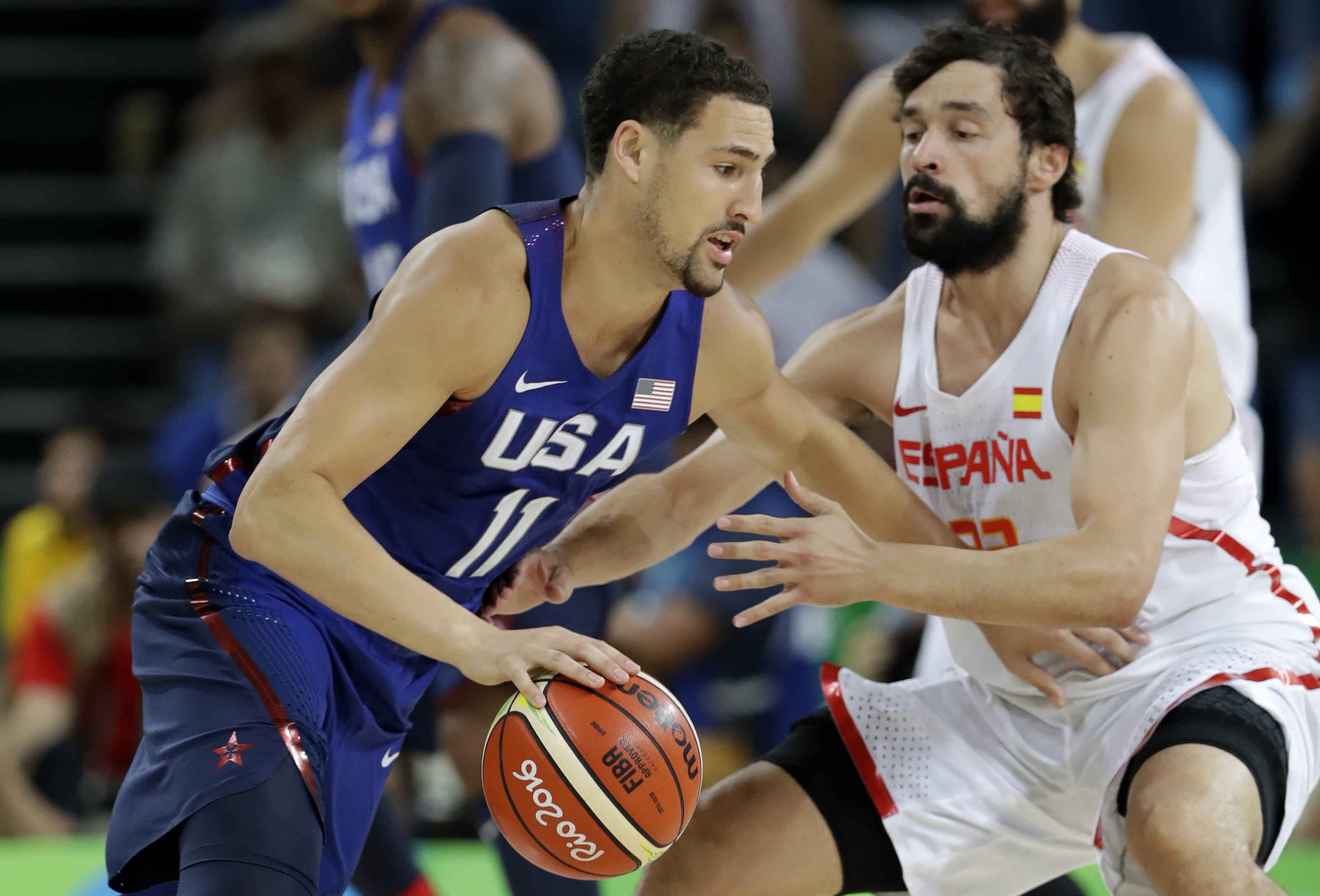 United States' Klay Thompson (11) drives past Spain's Sergio Llull, right, during a semifinal round basketball game at the 2016 Summer Olympics in Rio de Janeiro, Brazil, Friday, Aug. 19, 2016.