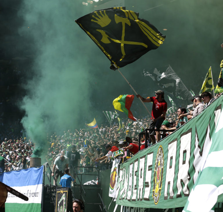 Portland Timbers supporters celebrate after a goal in the first half of an MLS soccer match against the Seattle Sounders, Sunday, Aug. 28, 2016, in Portland, Ore. (AP Photo/Ted S.