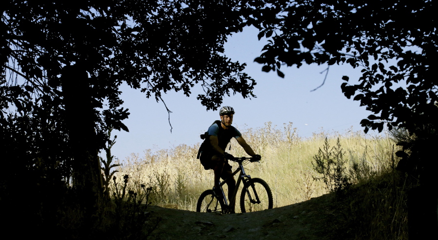 A biker rides along a trail in Salt Lake City. More than 100 million acres of America&#039;s most rugged landscapes designated as wilderness are off-limits to mountain bikers, but two U.S. Sens. Mike Lee and Orrin Hatch, both Utah Republicans, have introduced legislation that would allow bikers to join hikers and horseback riders in those scenic, undisturbed areas. The proposal is controversial within the biking community and opposed by conservationists who say bikes would erode trails and upset the five-decade notion of wilderness as primitive spaces.