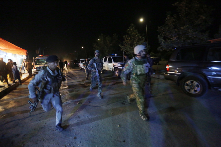 Afghan security forces rush to respond to a complex Taliban attack on the campus of the American University in the Afghan capital Kabul on Wednesday.