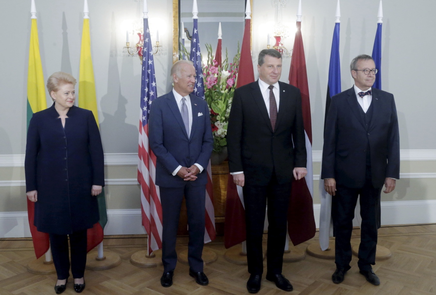 From left: Lithuanian President Dalia Grybauskaite, U.S. Vice President Joe Biden, Latvian President Raimonds Vejonis and Estonian President Toomas Hendrik Ilves pose for a photo during a press conference after their meeting in Riga, Latvia, Tuesday, Aug. 23, 2016. Biden has reaffirmed America&#039;s commitment to defending the Baltic nations of Latvia, Lithuania and Estonia against any threat from neighboring Russia.