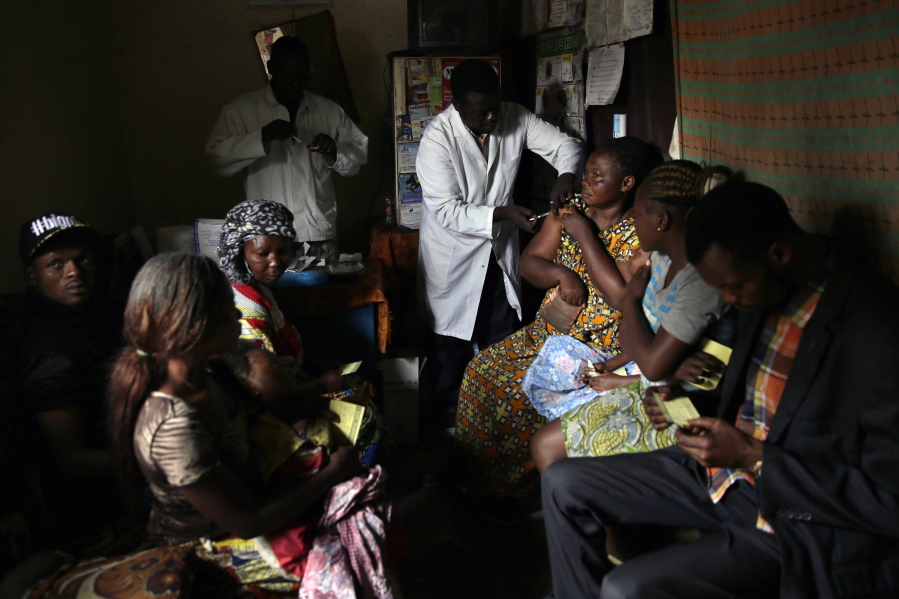 Residents of the Kisenso district of Kinshasa, Congo, get yellow fever vaccine injections on July 21. To date, yellow fever is estimated to have sickened about 5,000 people and caused at least 450 deaths.
