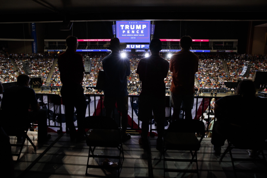 Supporters of Republican presidential candidate Donald Trump look on as he speaks during a campaign rally at Jacksonville Veterans Memorial Arena on Wednesday in Jacksonville, Fla.